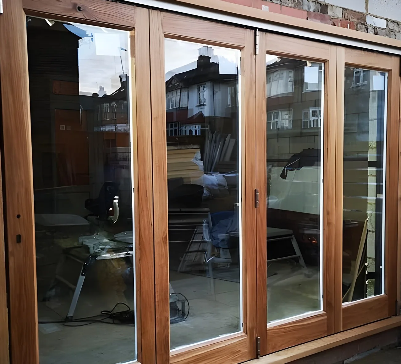 Hardwood timber french doors newly installed in a rear extension opening