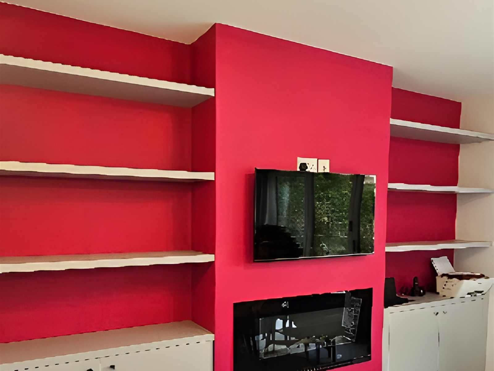 Media wall with red shelving — bespoke joinery project in London
