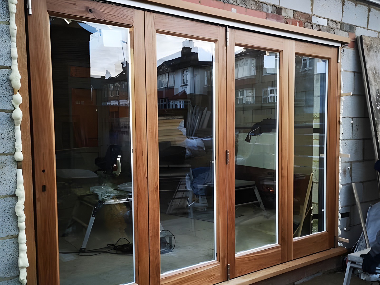 Hardwood timber french doors newly installed in a rear extension opening